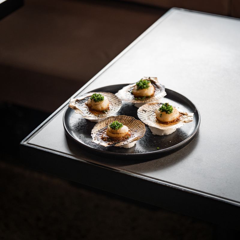 Grilled Scallop, an appetiser at Eddy + Wolff